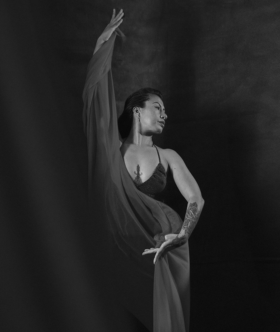 a female movement artist expressing emotion in a dance posture