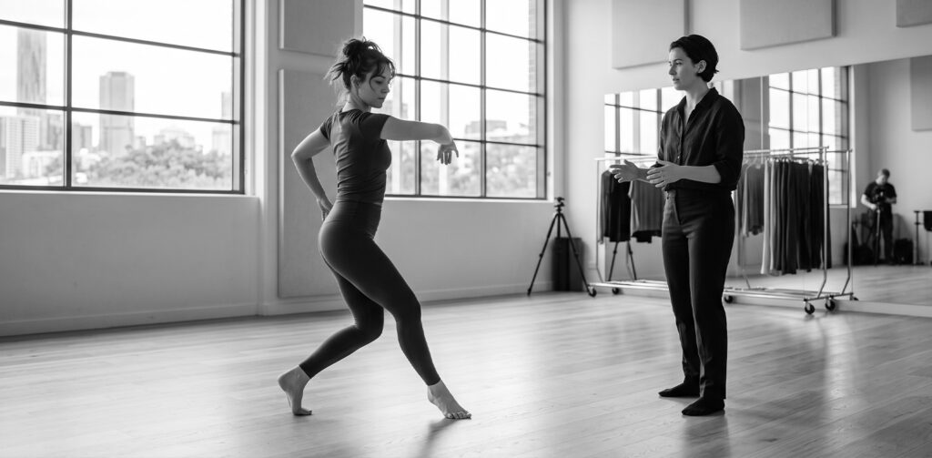 female choreographer directing a girl for movement 